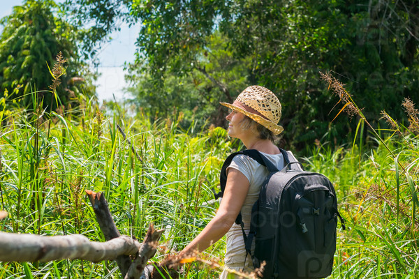 Woman hiking in tropical field