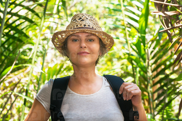 Woman hiking in tropical forest
