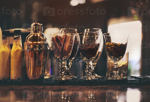 Classic bar counter with bottles in blurred background