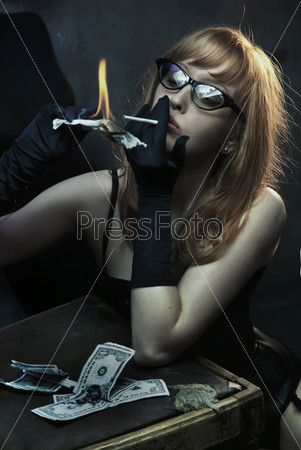 Sexy young woman smoking cigarette