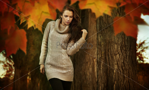 Young woman in a romantic autumn scenery