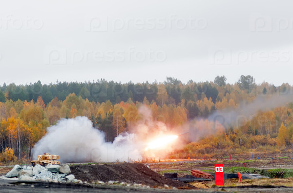 Nizhniy Tagil, Russia - September 27. 2013: Russia Arms Expo-2013 exhibition. TOS-1A system from fighting and resupply vehicles attacks target. Uralvagonzavod production