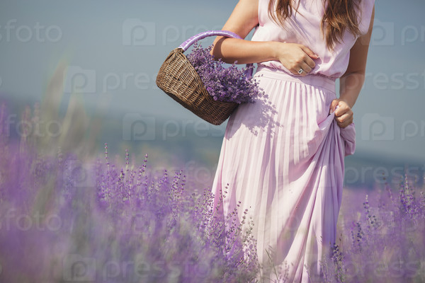 Beautiful girl on the lavender field. smiling beautiful brunette in the lavender field. summer portrait