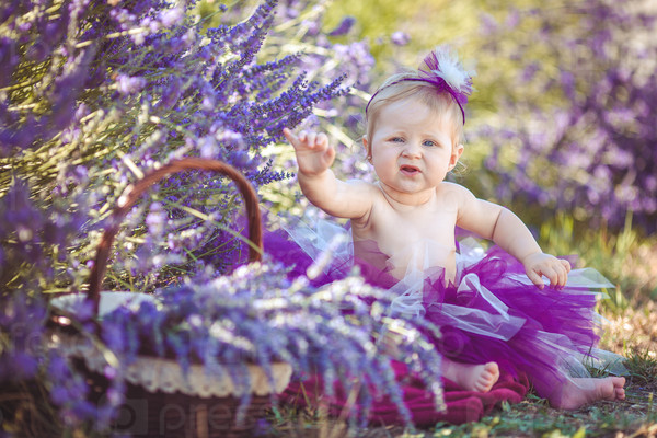 Portrait of an adorable smiling girl in lavender field