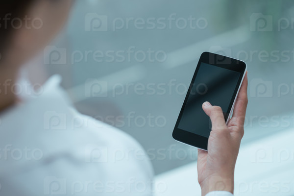 Person using smartphone, focus on device