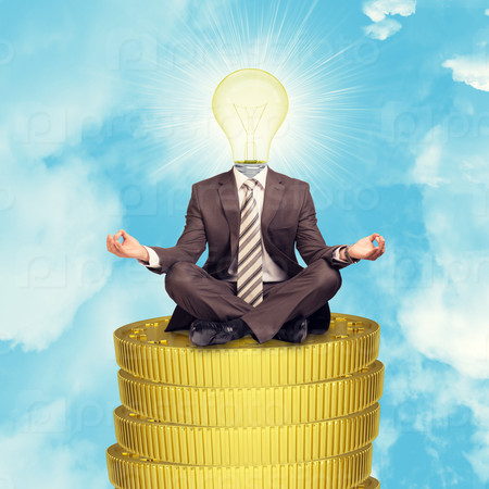 Businessman sitting on coins step in lotus posture with bulb instead head on blue sky background