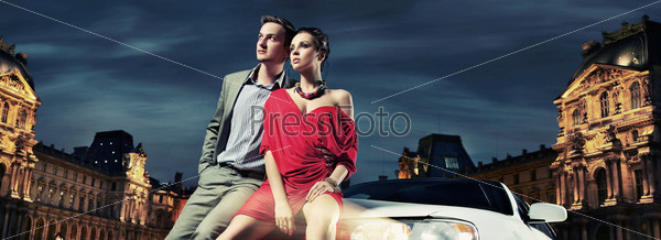 Beautiful couple sitting in a limousine