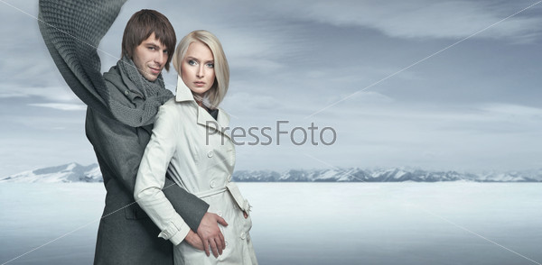 Handsome couple in the winter scenery