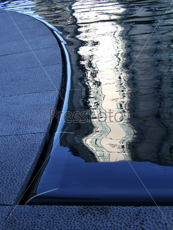 Reflections in water at edge of a pool