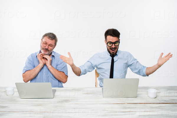 Stock Photo: The two colleagues working together at office on white background