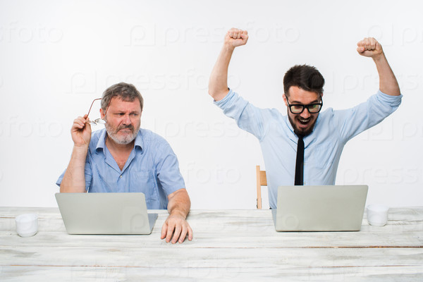 Stock Photo: The two colleagues working together at office on white background
