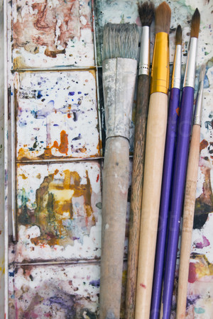 art paint brushes and palette vertically