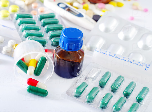 Color pills and medical bottle