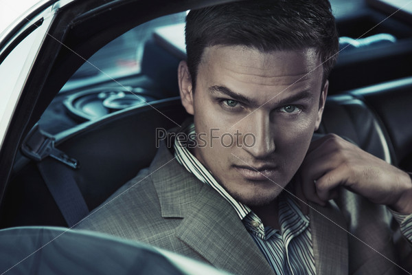 Portrait of a sexy man in the car