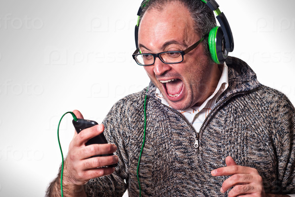 Man listen music on headphones and scream aloud