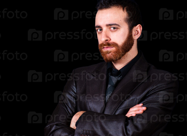 young businessman portrait on a black background