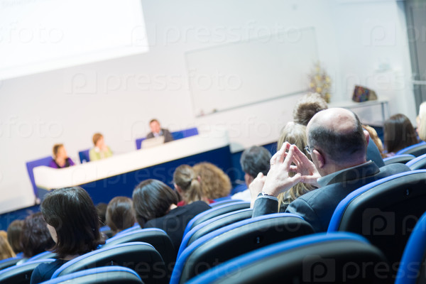 Business Conference and Presentation. Audience at the conference hall, stock photo