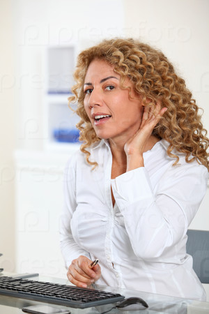 Portrait of businesswoman listening with attention