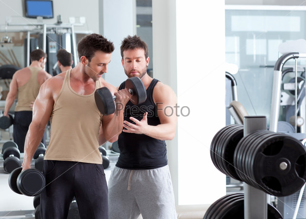 Gym personal trainer man with weight training