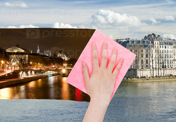 Travel concept - hand deletes night view of Paris by pink cloth from image and day cityscape is appearing, stock photo