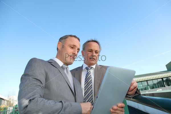 Businessmen meeting outside the office, stock photo