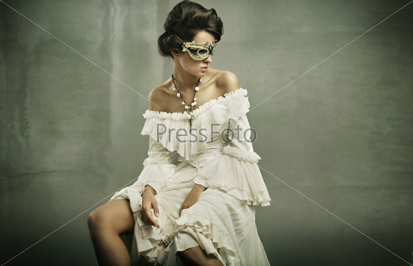 Fine art photo of a young woman wearing mask
