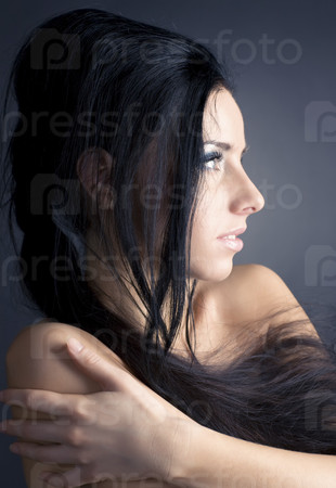 Young brunette woman profile portrait