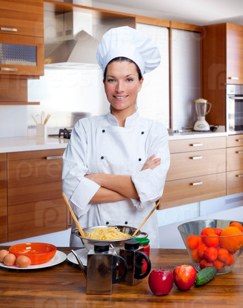 Chef woman portrait in the kitchen