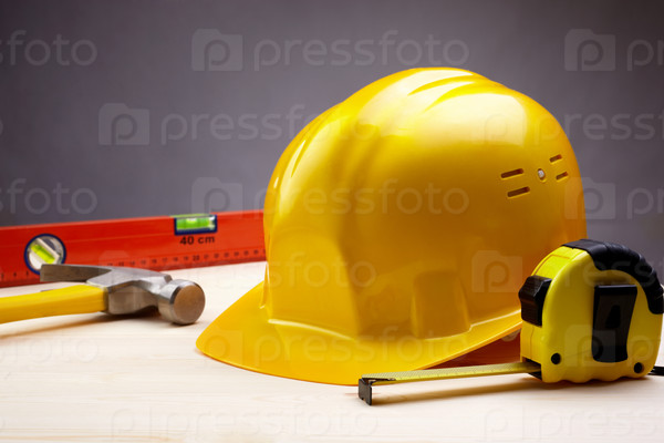 Industry concept with yellow hardhat, selective focus, stock photo