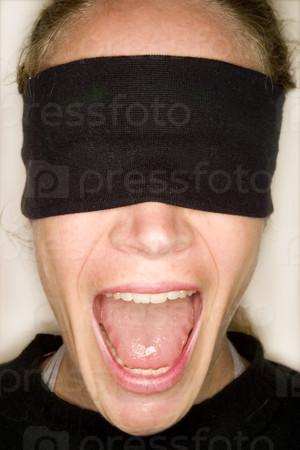A stock photograph of a blindfolded woman.