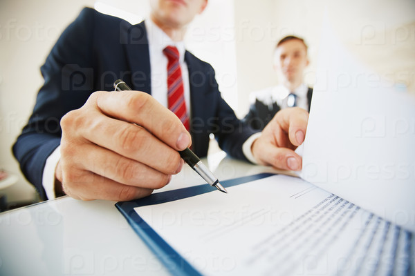 Businessman signing contract after negotiation