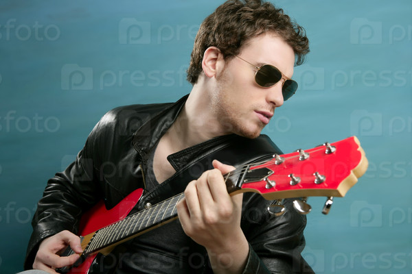 guitar rock star man sunglasses and leather perfect jacket over blue