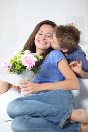 Little boy kissing his mom on mother\'s day