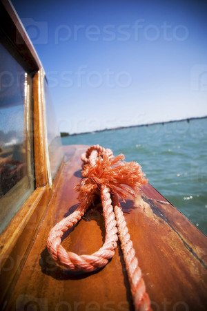 Sea travel. Red rope closeup.