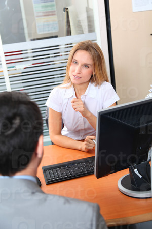 Man meeting financial adviser in office