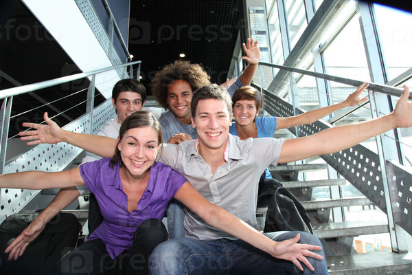 Group of happy young people at university