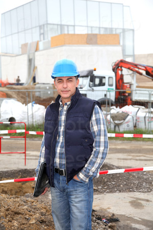 Engineer on construction site with security helmet