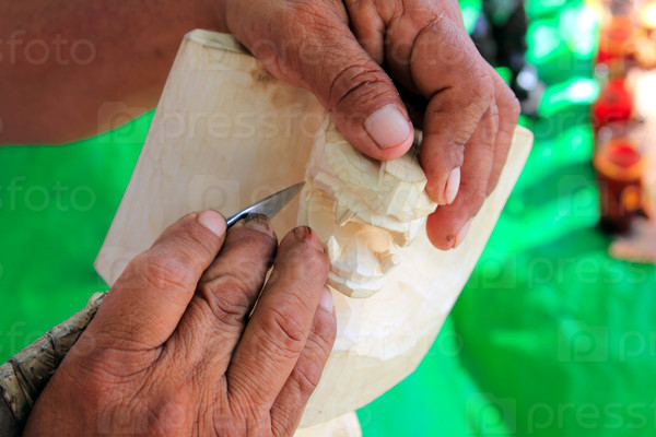 handcraft sculptor carving mayan jaguar in Chichen Itza Mexico