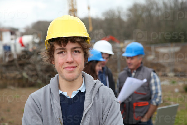 Portrait of teenager with security helmet