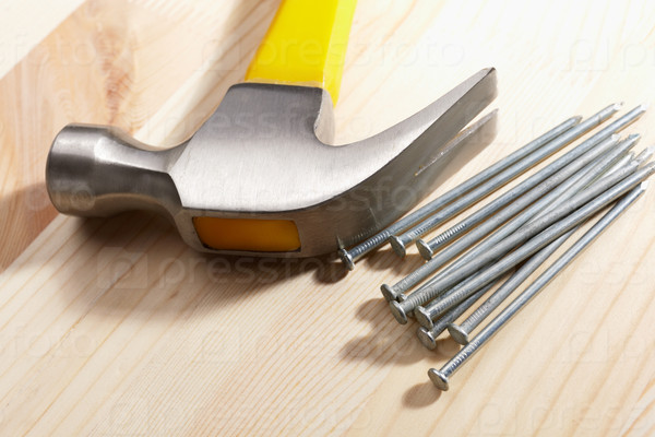 Hammer and some nails, celective focus, stock photo