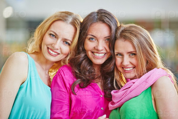Group of friendly and stylish young women looking at camera