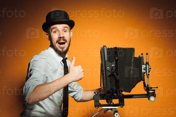 young man with retro camera