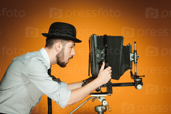 young man with retro camera