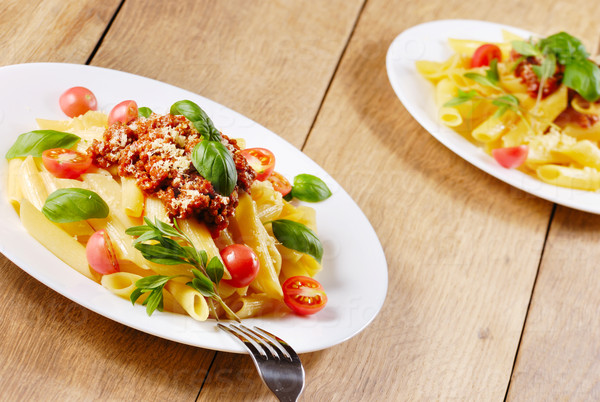 Rigatoni pasta with a tomato bolognese beef sauce and Parmigiano-Reggiano