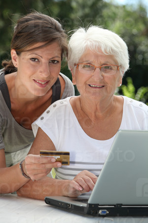 Elderly woman doing shopping on internet