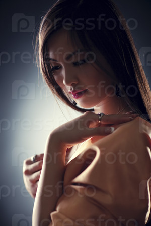 Young japan woman tender portrait. Shallow dof effect.