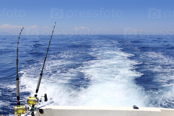 blue sea fishing sunny day trolling rod reels wake ocean big game