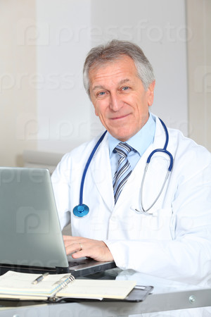 Closeup of doctor working on computer in the office