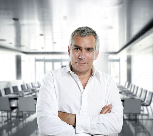 senior expertise gray hair businessman posing interior white modern office [Photo Illustration]