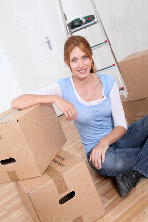 Young woman sitting in new apartment